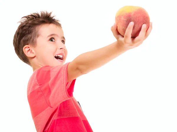 Little naughty boy outstretch the peach — Stock Photo, Image