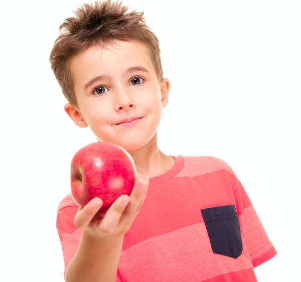 Pequeño niño travieso extender la manzana — Foto de Stock