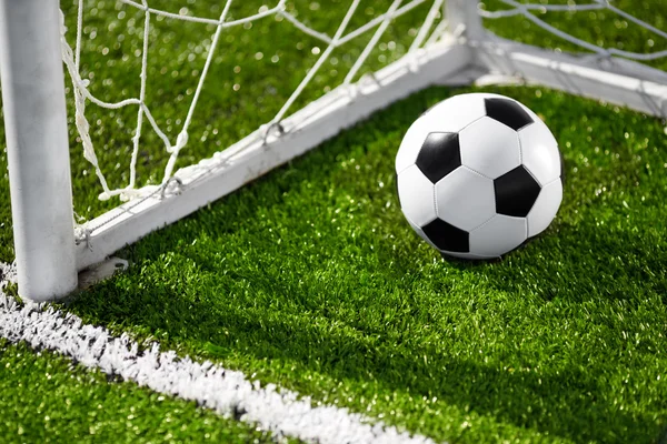 Soccer ball and goal net — Stock Photo, Image