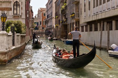 Gondolier on Venice Street clipart