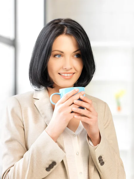 Lovely businesswoman with mug — Stock Photo, Image
