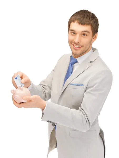 Man with piggy bank and money — Stock Photo, Image