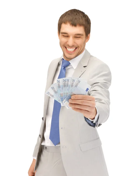 Pohledný muž s euro hotovost — Stock fotografie