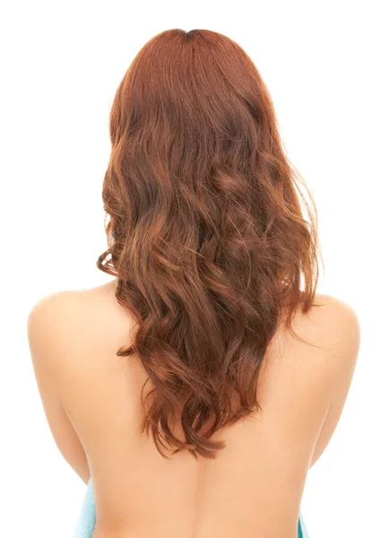 Kvinde med langt hår fra bagsiden - Stock-foto