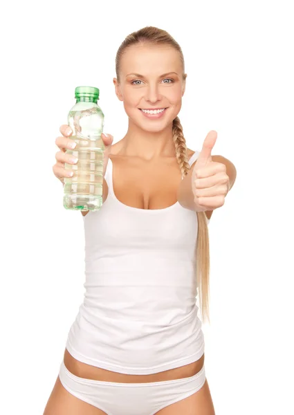 年轻美丽的女人，拿着一瓶水 免版税图库图片