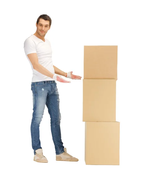 Handsome man with big boxes — Stock Photo, Image