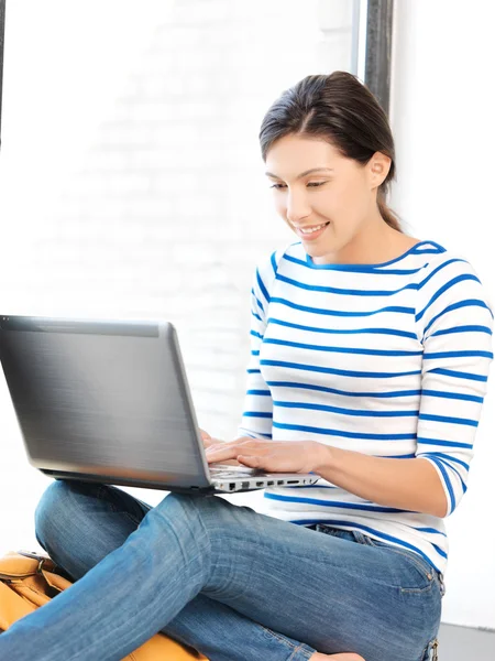 Happy teenage girl with laptop computer — Stock Photo, Image