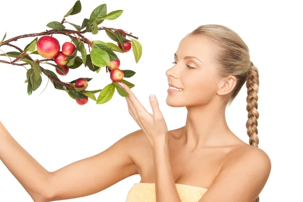 Lovely woman with apple twig Stock Picture