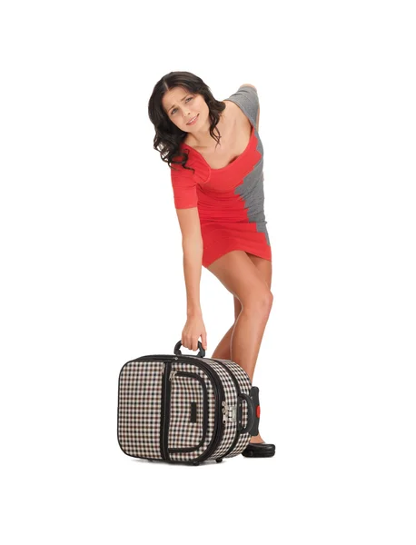 Unglückliche Frau mit schwerem Koffer — Stockfoto