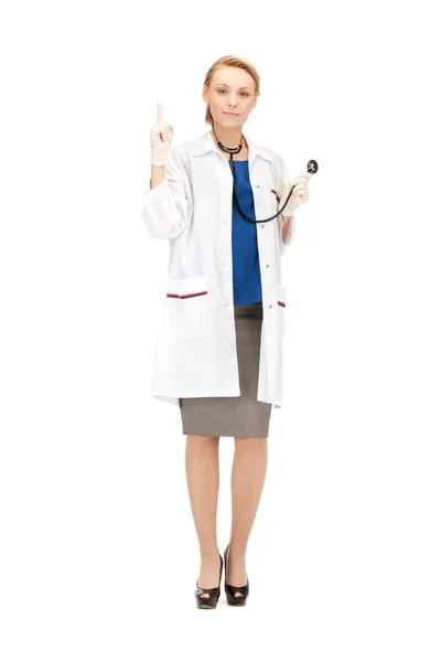 Женщина-врач с поднятым пальцем Стоковая Картинка