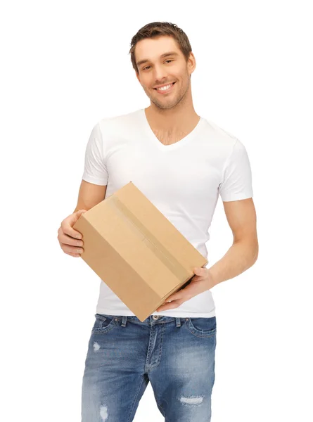 Man in wit overhemd met parsel — Stockfoto
