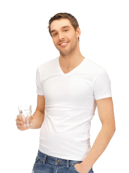 Muž v bílé košili s sklenicí vody — Stock fotografie