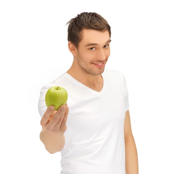 Mannen i vit skjorta med grönt äpple — Stockfoto