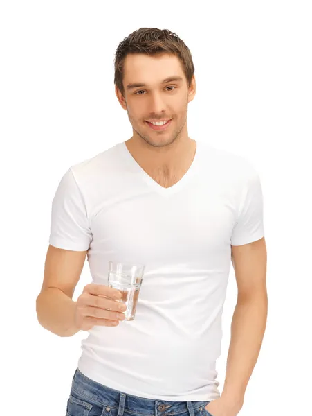 stock image Man in white shirt with glass of water