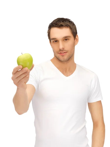 Hombre de camisa blanca con manzana verde —  Fotos de Stock