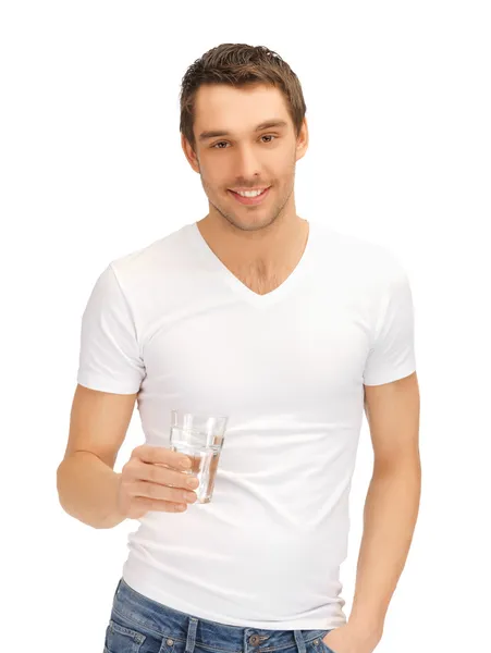 Mann im weißen Hemd mit Glas Wasser lizenzfreie Stockbilder