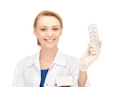 Attractive female doctor with pills clipart