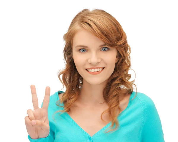 Teenage girl showing victory sign — Stock Photo, Image