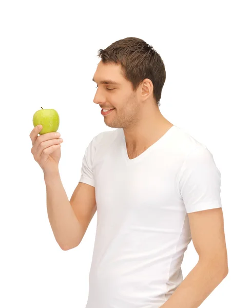 青リンゴと白いシャツの男 — ストック写真