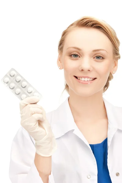 Attractive female doctor with pills — Stock Photo, Image