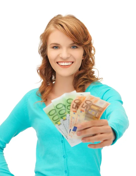Glad tonårsflicka med euro i kontanter — Stockfoto