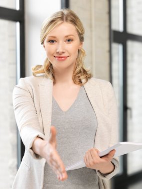 Woman with an open hand ready for handshake clipart