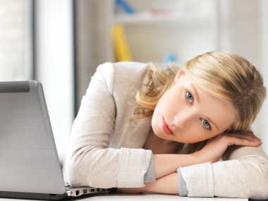 Tired woman with laptop computer clipart