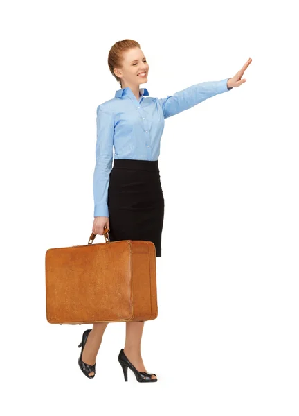 Hitch-hiking woman with suitcase — Stock Photo, Image
