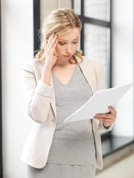 Worried woman with documents — Stock Photo, Image
