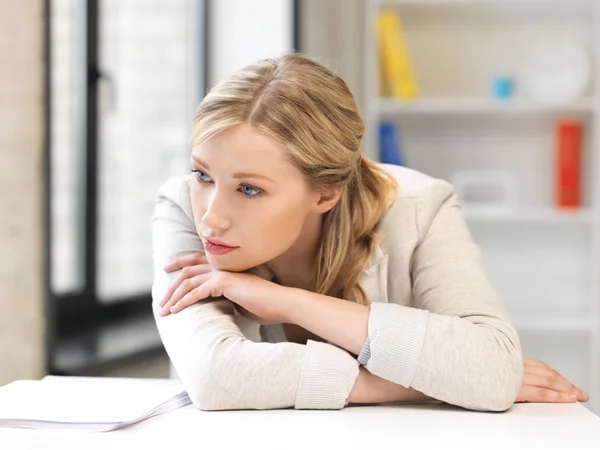 Unhappy woman in office — Stock Photo, Image