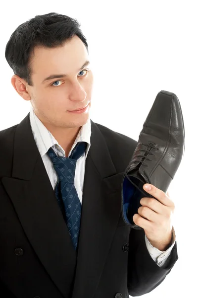 Salesman with black leather boot — Stock Photo, Image