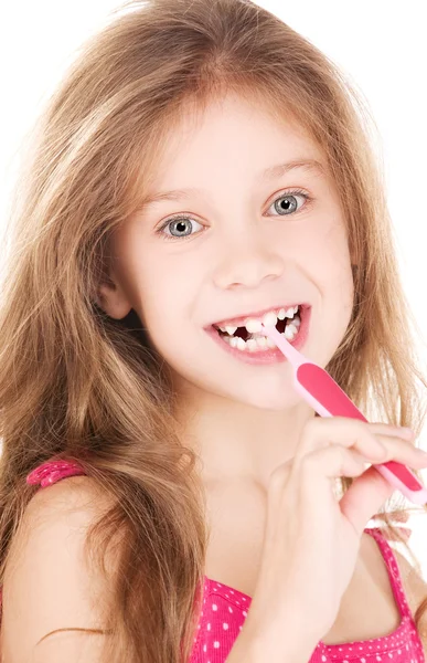 Щаслива дівчина з зубною щіткою — стокове фото
