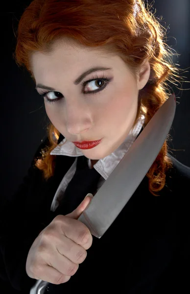 Crazy schoolgirl with knife — Stock Photo, Image