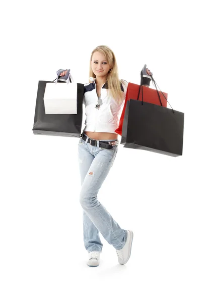 Teenage girl with shopping bags over white — Stock Photo, Image