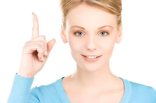 Vrouw met haar vinger omhoog — Stockfoto