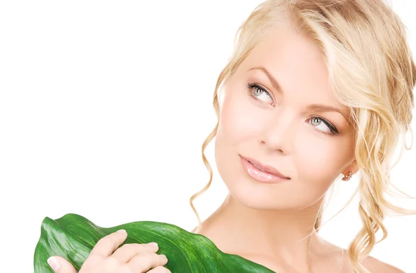 Woman with green leaf Stock Photo