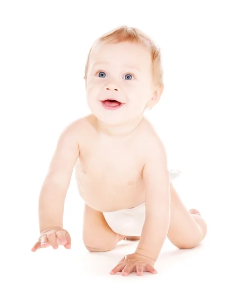 Crawling baby boy in diaper Royalty Free Stock Photos