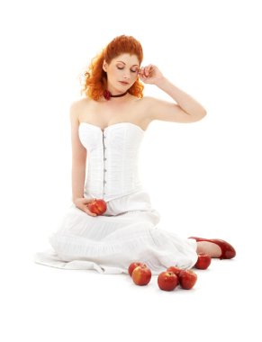 Lovely redhead in red shoes with apples clipart