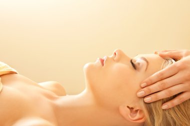 Beautiful woman in massage salon clipart