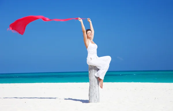 Happy woman with red sarong — Stock Photo, Image