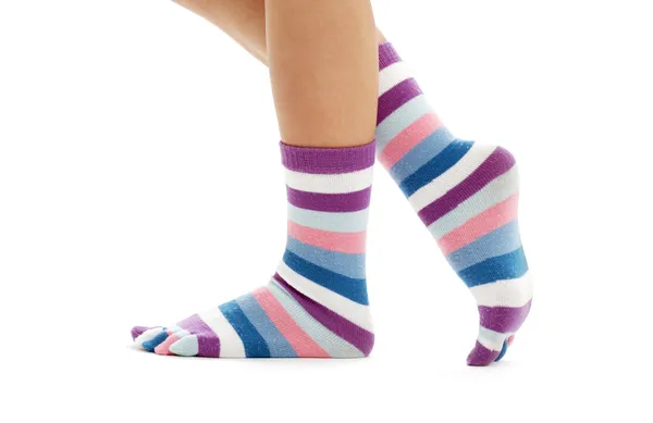 Pernas bonitas em meias engraçadas — Fotografia de Stock