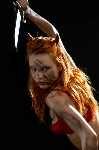 Vermelho diabo menina com uma faca — Fotografia de Stock