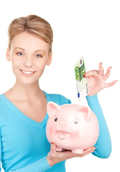 Piękne kobiety z piggy bank i pieniądze — Zdjęcie stockowe