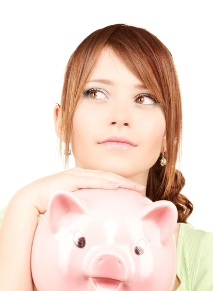 Linda menina adolescente com banco porquinho — Fotografia de Stock