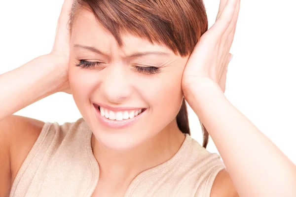 Olycklig kvinna med händerna på öron — Stockfoto