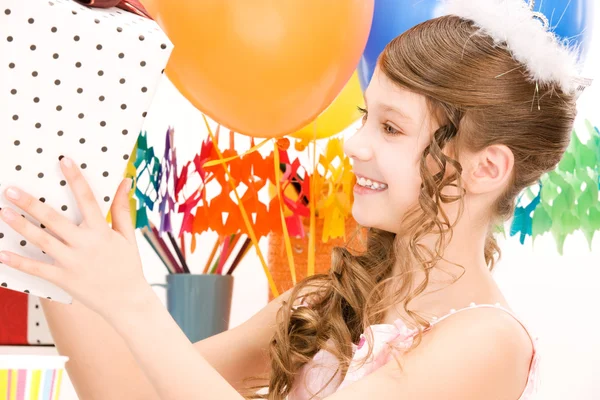 Party girl with balloons and gift box — Stock Photo, Image
