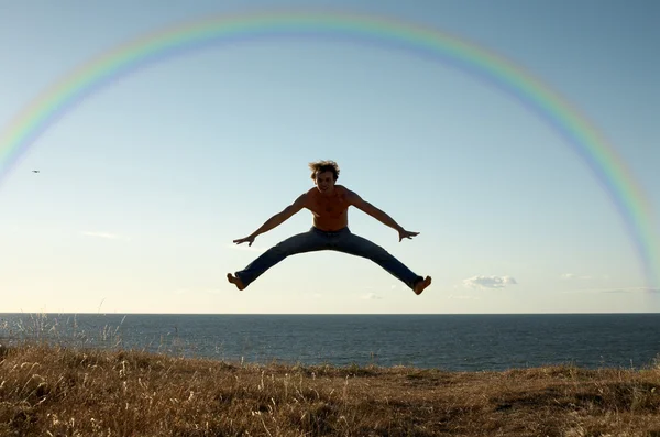 Learning to fly under rainbow — Stock Photo, Image