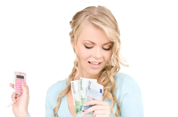 Hesap makinesi ve para ile mutlu bir kadın — Stok fotoğraf