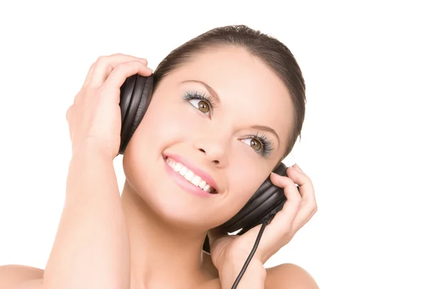 Szczęśliwa kobieta w słuchawkach — Zdjęcie stockowe