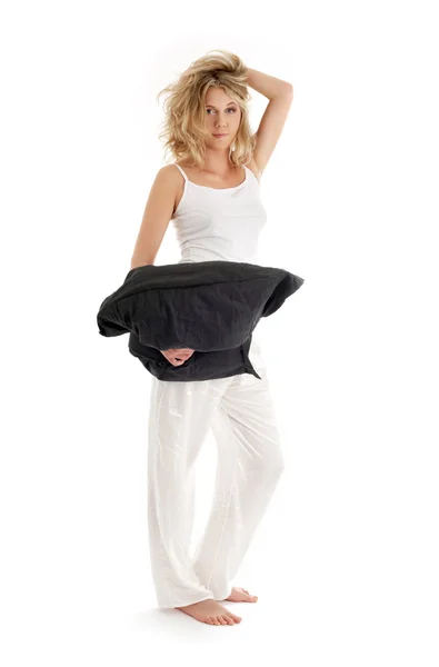 Happy blond with black pillow — Stock Photo, Image